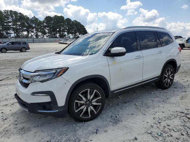HONDA PILOT TOUR 2022 with VIN 5FNYF6H99NB016083 - Photo from auction