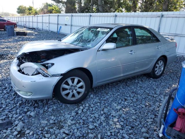 TOYOTA CAMRY LE 2004 with VIN 4T1BF32K74U575276 - Photo from auction