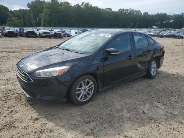 FORD FOCUS SE 2017 with VIN 1FADP3F28HL329570 - Photo from auction