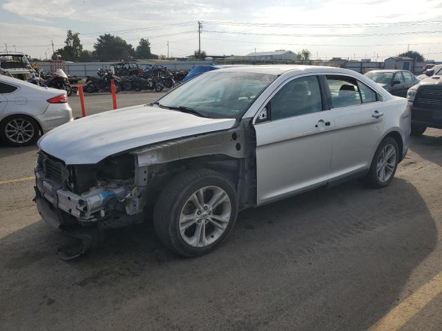 FORD TAURUS SE 2015 with VIN 1FAHP2D90FG138923 - Photo from auction