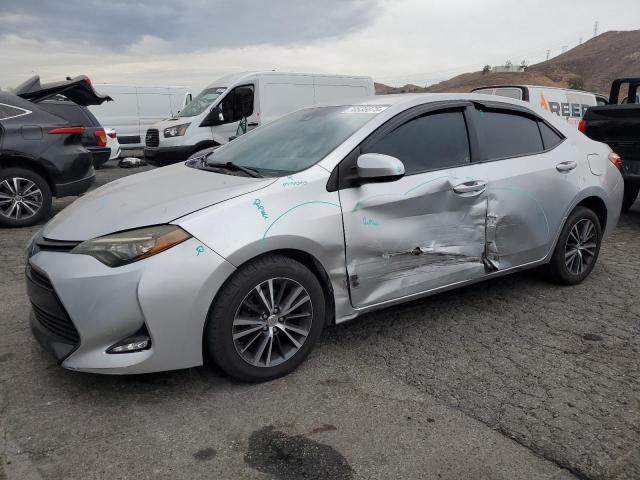 TOYOTA COROLLA L 2017 with VIN 5YFBURHE4HP621034 - Photo from auction