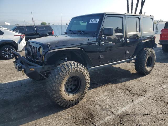 JEEP WRANGLER U 2015 with VIN 1C4HJWDG9FL574954 - Photo from auction