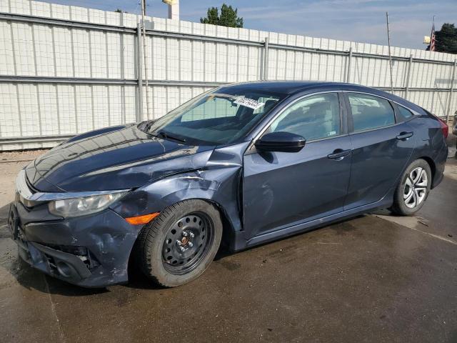 HONDA CIVIC LX 2018 with VIN 19XFC2F61JE021098 - Photo from auction