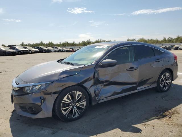 HONDA CIVIC EX 2018 with VIN JHMFC1F38JX041864 - Photo from auction