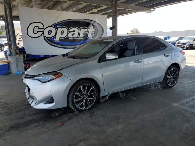 TOYOTA COROLLA L 2017 with VIN 5YFBURHE7HP620847 - Photo from auction