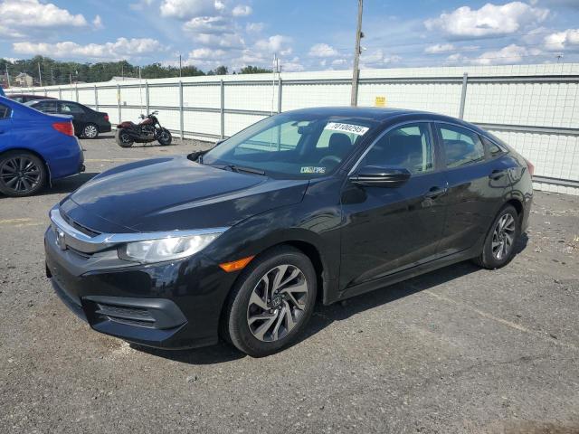 HONDA CIVIC EX 2018 with VIN 19XFC2F73JE201191 - Photo from auction
