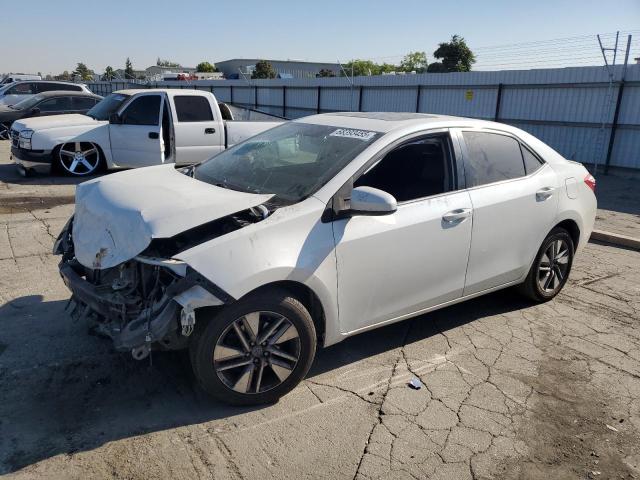 TOYOTA COROLLA EC 2014 with VIN 5YFBPRHE0EP113582 - Photo from auction