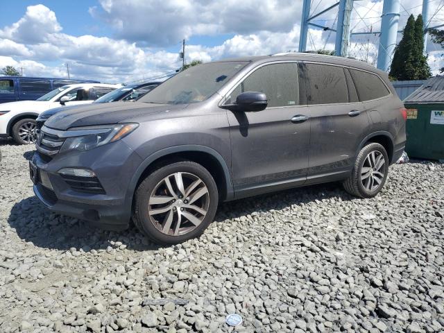 HONDA PILOT TOUR 2017 with VIN 5FNYF6H97HB099839 - Photo from auction