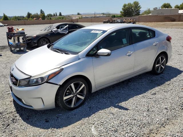 KIA FORTE EX 2017 with VIN 3KPFL4A8XHE054101 - Photo from auction