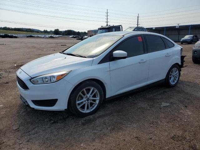 FORD FOCUS SE 2018 with VIN 1FADP3F21JL214699 - Photo from auction