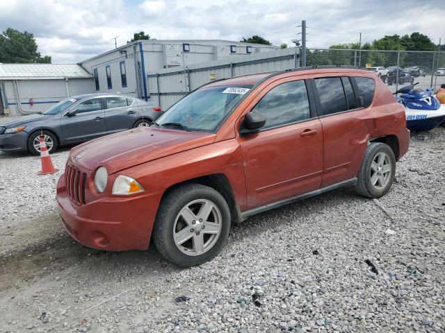 JEEP COMPASS 2010 with VIN 1J4NT4FB7AD601911 - Photo from auction