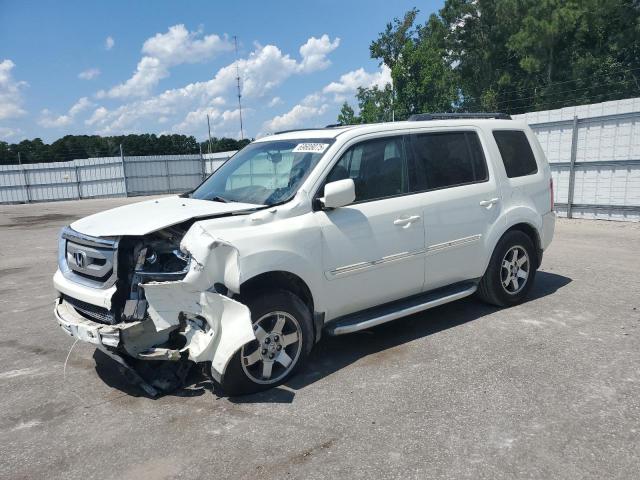 HONDA PILOT TOURING 2011 with VIN 5FNYF4H95BB046889 - Photo from auction