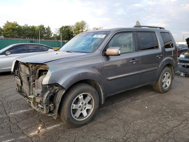 HONDA PILOT TOURING 2011 with VIN 5FNYF4H91BB033217 - Photo from auction