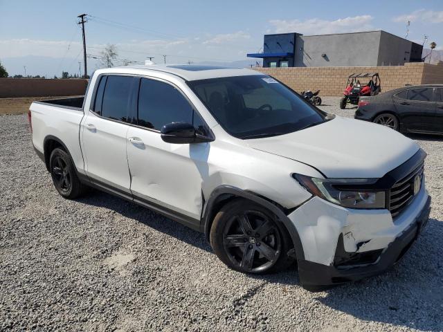 Photo 4 from auction – 2022 HONDA RIDGELINE with VIN 5FPYK3F84NB020165