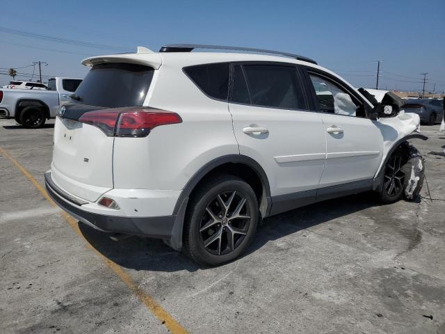 Photo 3 from auction – 2018 TOYOTA RAV4 SE with VIN JTMNFREV3JD119474