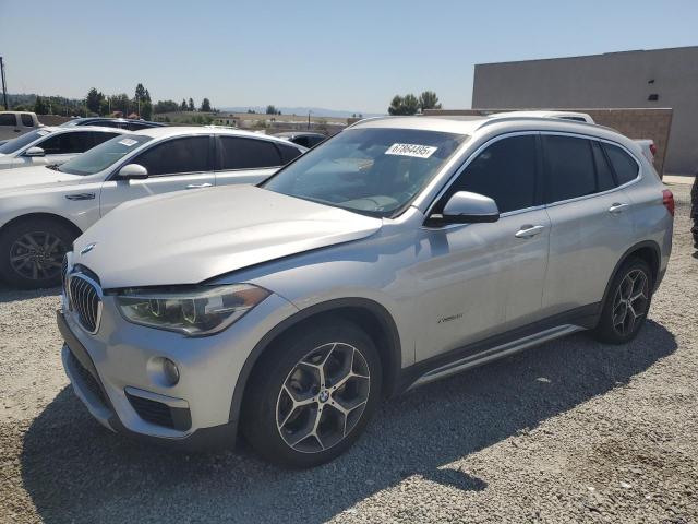 BMW X1 XDRIVE28I 2017 with VIN WBXHT3Z33H4A55352 - Photo from auction