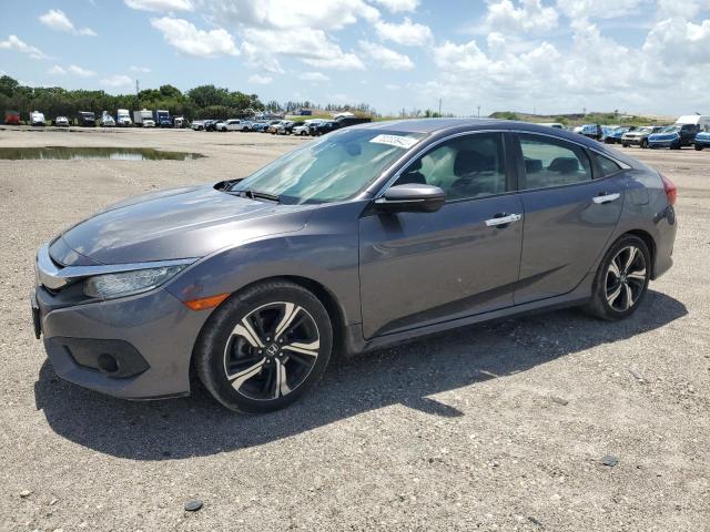 HONDA CIVIC TOUR 2016 with VIN 2HGFC1F93GH656200 - Photo from auction