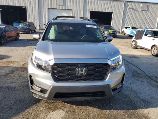 Photo 5 from auction – 2023 HONDA PASSPORT E with VIN 5FNYF8H55PB008414