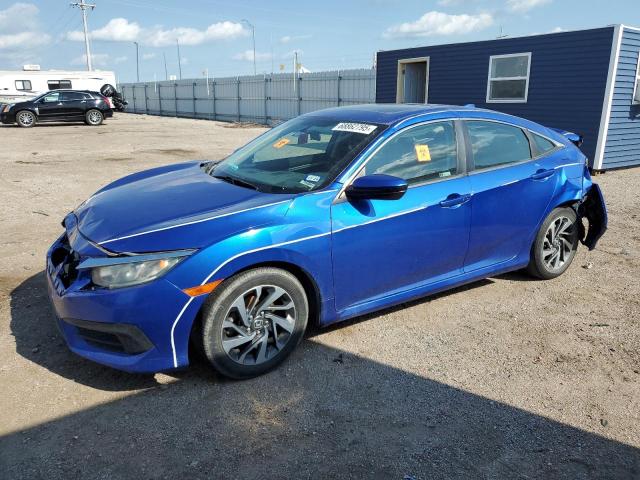 HONDA CIVIC EX 2018 with VIN 19XFC2F76JE018061 - Photo from auction