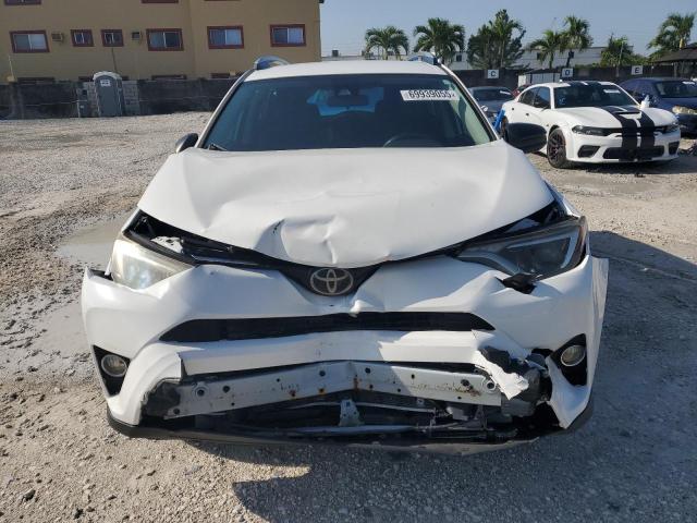 Photo 5 from auction – 2018 TOYOTA RAV4 LE with VIN 2T3ZFREV8JW475231