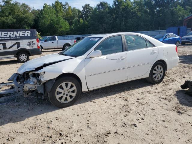 TOYOTA CAMRY LE 2004 with VIN 4T1BF32KX4U070381 - Photo from auction