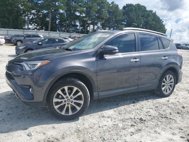 TOYOTA RAV4 LIMITED 2018 with VIN 2T3YFREV2JW506257 - Photo from auction