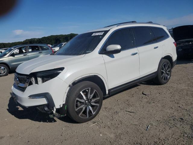 HONDA PILOT TOUR 2022 with VIN 5FNYF6H62NB007148 - Photo from auction