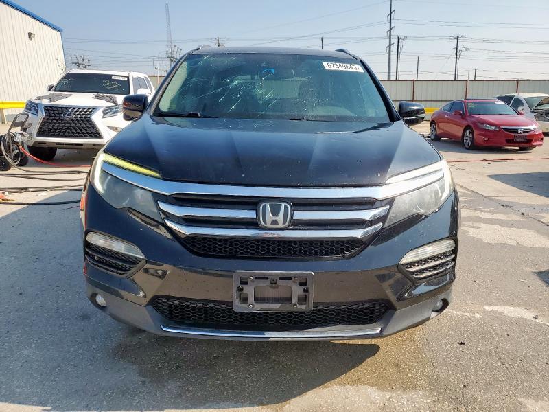 Photo 5 from auction – 2017 HONDA PILOT TOUR with VIN 5FNYF5H98HB044150