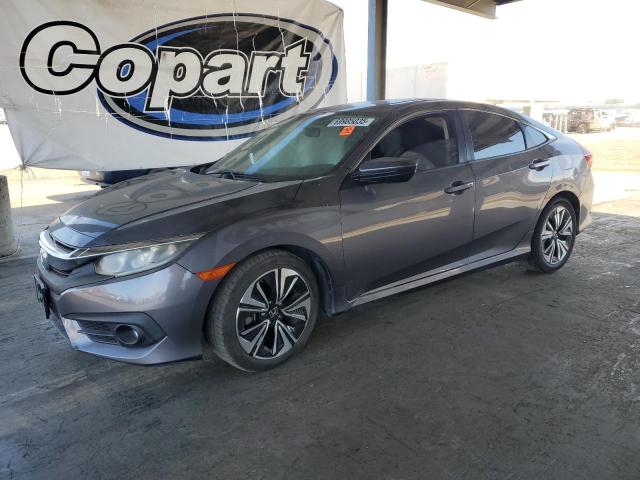 HONDA CIVIC EX 2017 with VIN 19XFC1F37HE204810 - Photo from auction