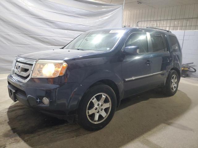 HONDA PILOT TOUR 2010 with VIN 5FNYF4H98AB020849 - Photo from auction