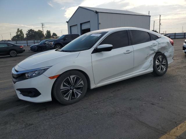 HONDA CIVIC EX 2018 with VIN JHMFC1F34JX002656 - Photo from auction