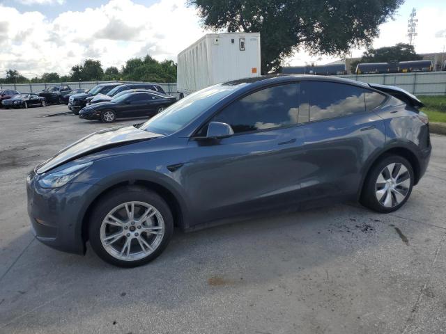 TESLA MODEL Y 2023 with VIN 7SAYGDEE2PA142890 - Photo from auction