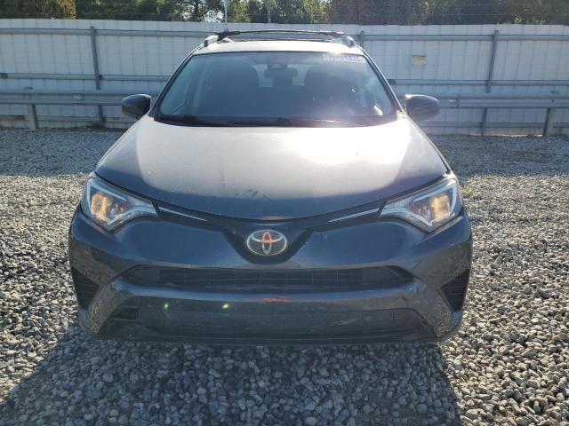Photo 5 from auction – 2017 TOYOTA RAV4 LE with VIN JTMZFREV6HJ141272