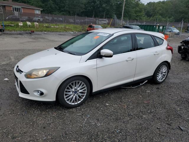 FORD FOCUS TITANIUM 2014 with VIN 1FADP3N24EL409557 - Photo from auction