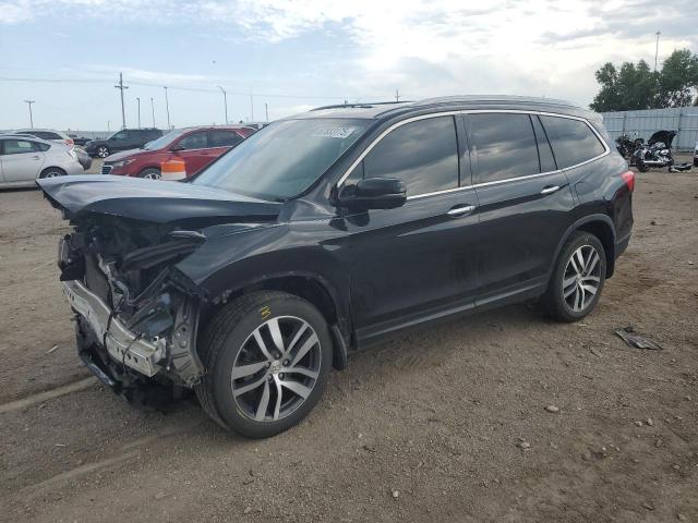 HONDA PILOT TOURING 2017 with VIN 5FNYF6H93HB101540 - Photo from auction
