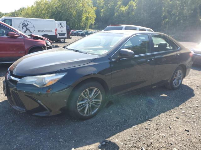 TOYOTA CAMRY LE 2017 with VIN 4T1BF1FK0HU664255 - Photo from auction