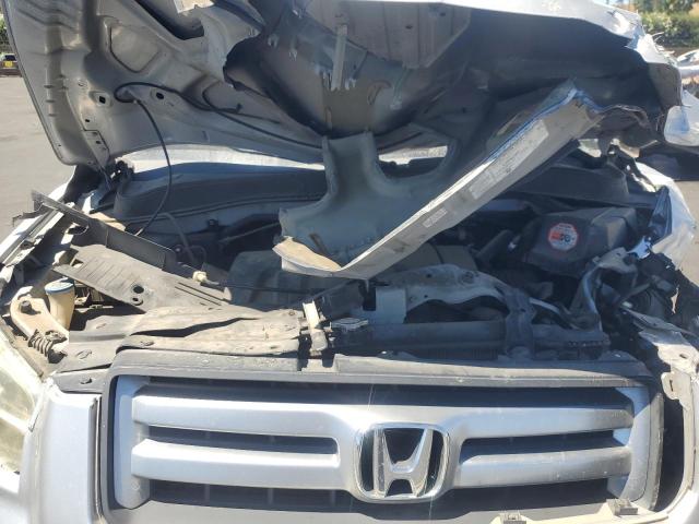 Photo 12 from auction – 2006 HONDA PILOT LX with VIN 2HKYF18136H556660