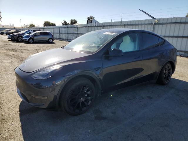 TESLA MODEL Y 2024 with VIN 7SAYGAEE1RF165484 - Photo from auction