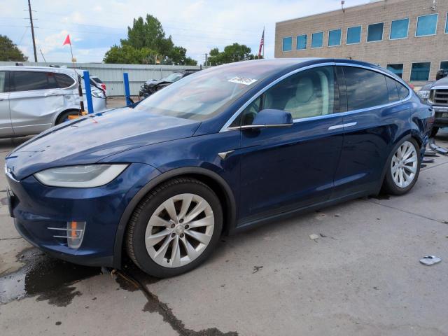 TESLA MODEL X 2018 with VIN 5YJXCAE2XJF090976 - Photo from auction