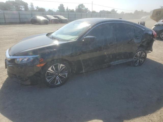 HONDA CIVIC EX 2018 with VIN JHMFC1F30JX040949 - Photo from auction