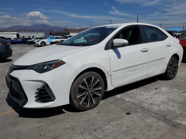 TOYOTA COROLLA L 2017 with VIN 5YFBURHE1HP573198 - Photo from auction