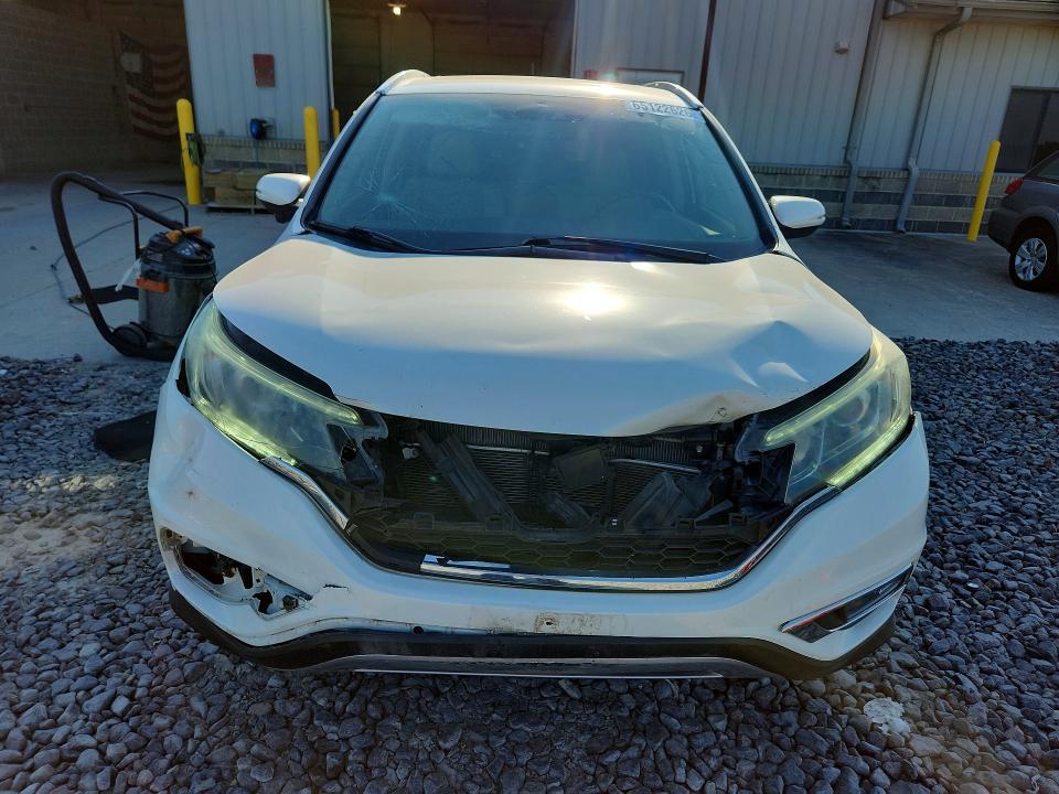 Photo 5 from auction – 2016 HONDA CR-V with VIN 5J6RM4H91GL115103