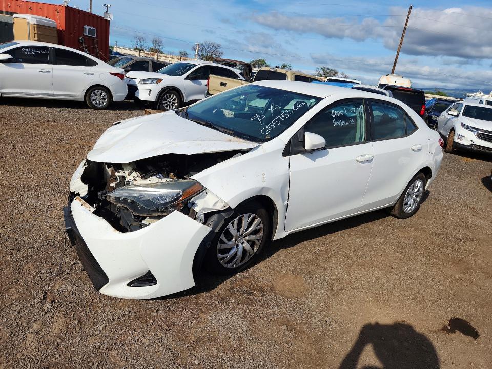 TOYOTA COROLLA 2018 with VIN 5YFBURHE6JP773290 - Photo from auction