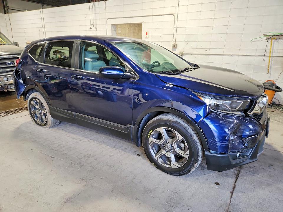 Photo 4 from auction – 2018 HONDA CR-V with VIN 7FARW2H8XJE080006
