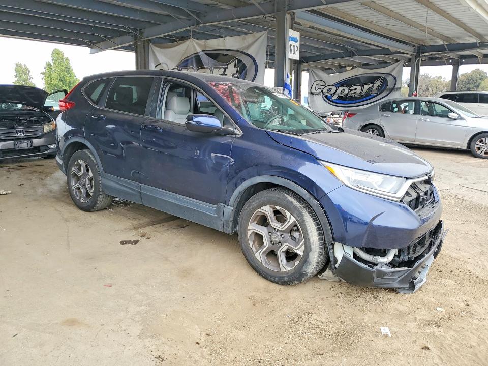 Photo 4 from auction – 2018 HONDA CR-V with VIN 7FARW1H80JE028572