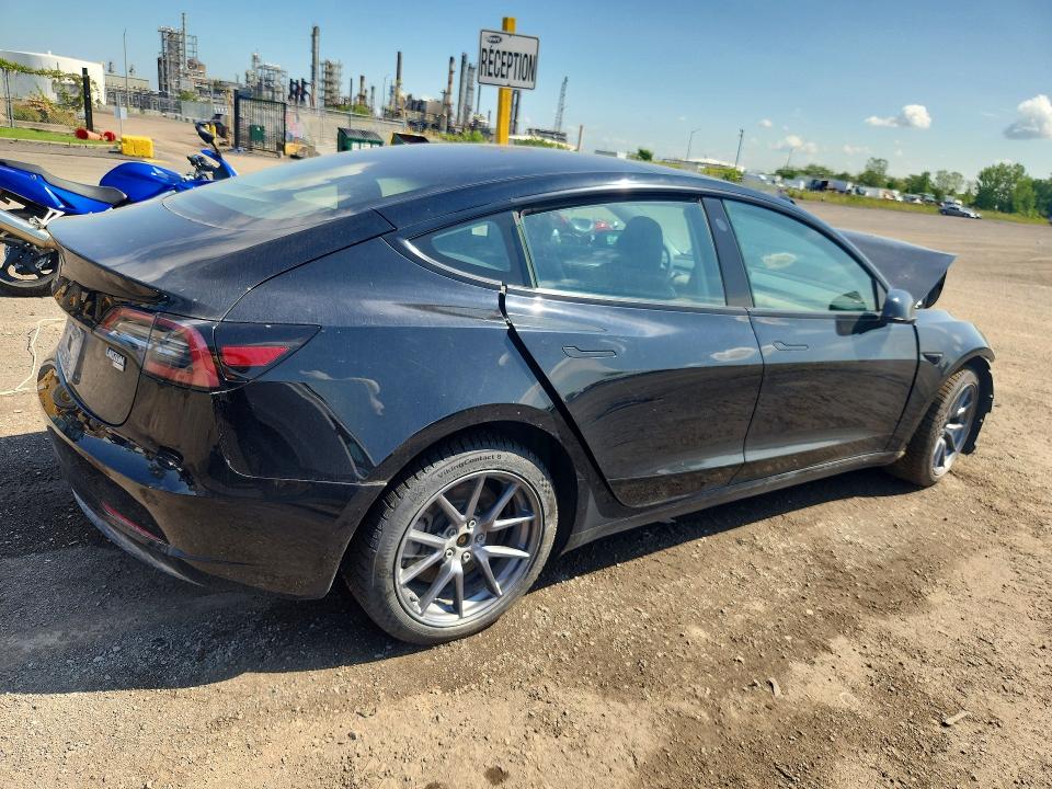Photo 3 from auction – 2023 TESLA MODEL 3 with VIN LRW3E1FA1PC944397