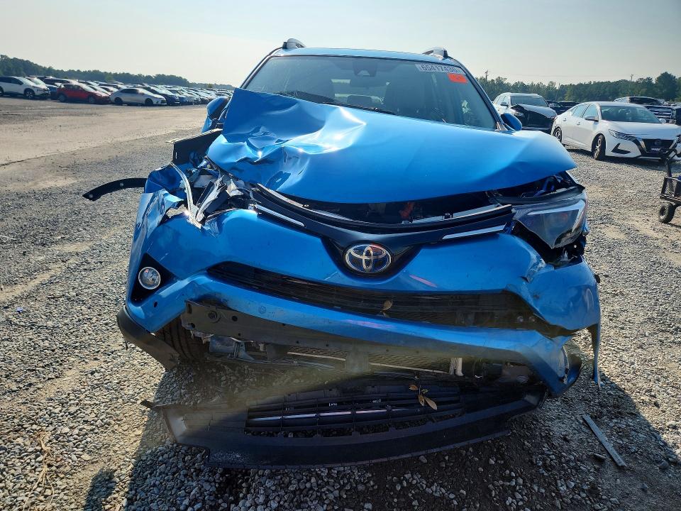 Photo 5 from auction – 2018 TOYOTA RAV4 HYBRID with VIN JTMRJREVXJD222066