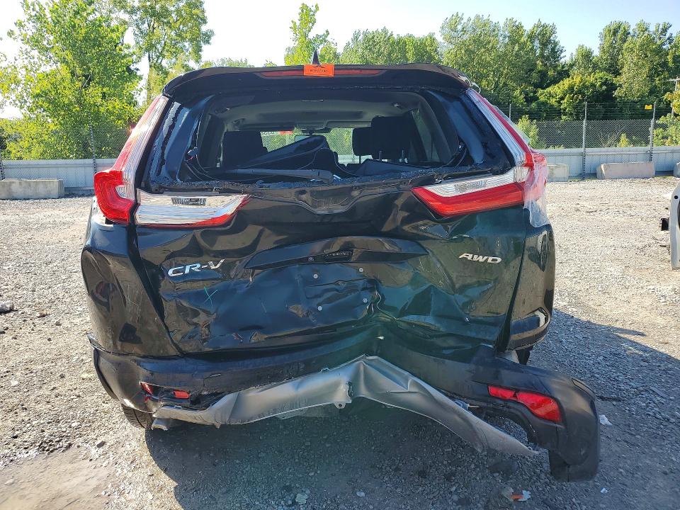 Photo 6 from auction – 2018 HONDA CR-V with VIN 7FARW2H51JE095502