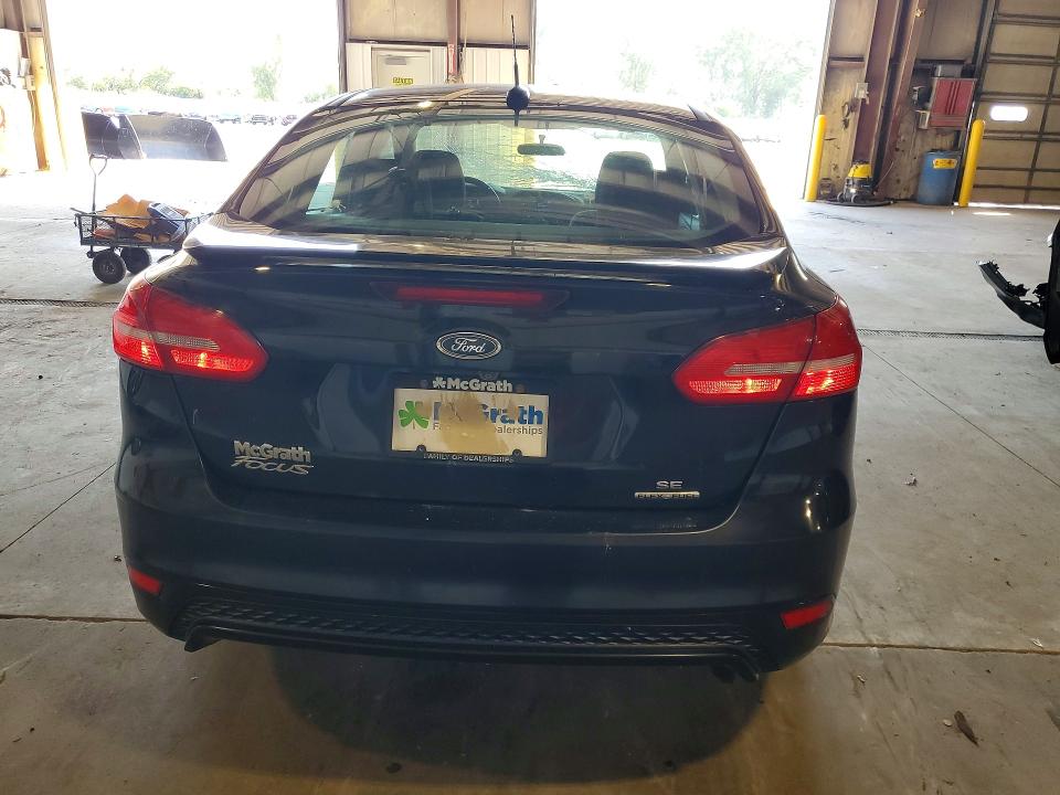 Снимка 6 от търг – 2016 FORD FOCUS с VIN 1FADP3F24GL230033
