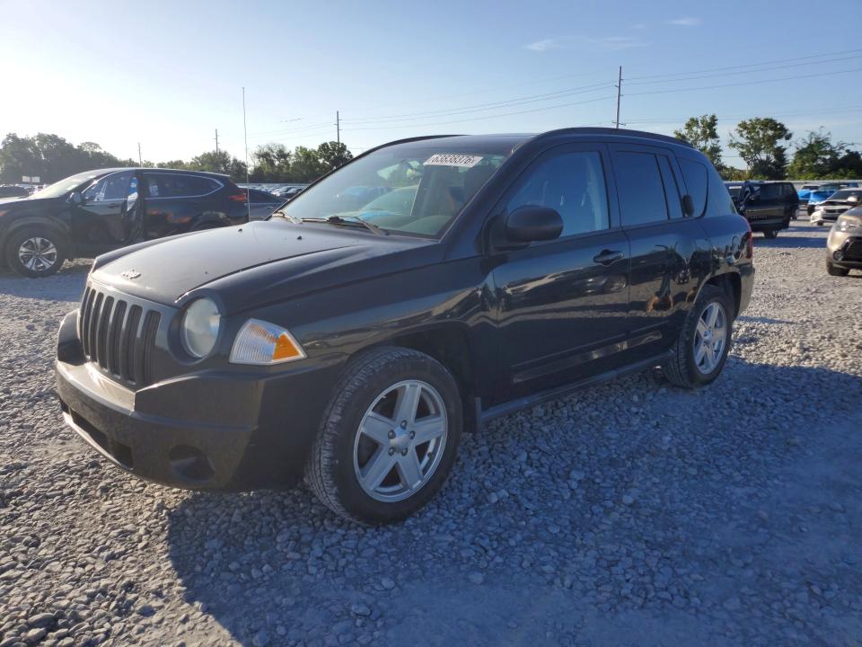 JEEP COMPASS 2010 with VIN 1J4NT4FB0AD513797 - Photo from auction